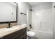 Updated bathroom with dark cabinets, a vanity sink, and a shower-tub combination at 1657 Park Terrace Ct, Indianapolis, IN 46229