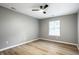 Bright bedroom with modern ceiling fan, neutral color palette and stylish floors at 1657 Park Terrace Ct, Indianapolis, IN 46229