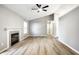 Living room featuring stylish floors, fireplace, and a neutral, modern color palette at 1657 Park Terrace Ct, Indianapolis, IN 46229