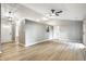Open-concept living room with vaulted ceilings, updated floors, and lots of natural light at 1657 Park Terrace Ct, Indianapolis, IN 46229