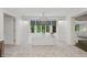 Spacious bathroom featuring a standalone soaking tub with large windows at 1805 Wood Valley Dr, Carmel, IN 46032