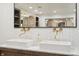 Double vanity bathroom with marble countertop and stylish brass fixtures at 1805 Wood Valley Dr, Carmel, IN 46032