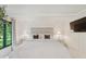 Serene bedroom with white bedding, mirrored nightstands, and large windows at 1805 Wood Valley Dr, Carmel, IN 46032