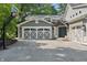 Charming two-car garage home with a basketball hoop in driveway at 1805 Wood Valley Dr, Carmel, IN 46032