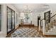 Elegant foyer with hardwood floors, staircase, and an open view to the living room at 1805 Wood Valley Dr, Carmel, IN 46032