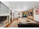 Open game room with pool table, wood-accent wall, and glass-paneled doorway at 1805 Wood Valley Dr, Carmel, IN 46032