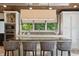 Stylish kitchen with modern appliances, center island, and bar stool seating at 1805 Wood Valley Dr, Carmel, IN 46032