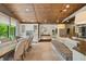 Open floor plan showcases kitchen, dining area, and bench seating with natural light at 1805 Wood Valley Dr, Carmel, IN 46032