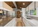 Well-lit kitchen features white cabinets, large island, and sleek countertops at 1805 Wood Valley Dr, Carmel, IN 46032
