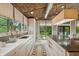 Bright kitchen boasts white cabinetry, stainless steel sink, and picturesque backyard view at 1805 Wood Valley Dr, Carmel, IN 46032