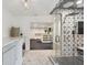 Well-appointed laundry room with tile floors, star-themed tiles, and glass shower at 1805 Wood Valley Dr, Carmel, IN 46032