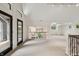 Spacious loft area with tall ceilings, large windows, and a view of the lower level, offering versatile living space at 1805 Wood Valley Dr, Carmel, IN 46032