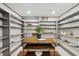 Organized pantry with open shelving and wooden table at 1805 Wood Valley Dr, Carmel, IN 46032