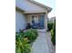 Inviting front porch with seating and lovely landscaping, perfect for relaxing outdoors at 1823 Long Lake Dr, Greenwood, IN 46143