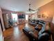 Bright living room with wood floors, a large sectional, and an entertainment center at 1823 Long Lake Dr, Greenwood, IN 46143