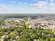Overhead view displaying the neighborhood layout with lush greenery, buildings, and roads at 1930 Bechtel Rd, Indianapolis, IN 46260