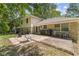 Spacious backyard with patio area, outdoor seating, and a grill, perfect for entertaining at 1930 Bechtel Rd, Indianapolis, IN 46260