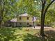 Backyard of a charming house with stone accents and an inviting outdoor patio area at 1930 Bechtel Rd, Indianapolis, IN 46260