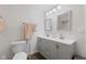 Bathroom featuring a double sink vanity, a toilet, and a towel rack at 1930 Bechtel Rd, Indianapolis, IN 46260