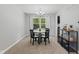 Cozy dining room featuring a round table with four chairs and a modern light fixture at 1930 Bechtel Rd, Indianapolis, IN 46260