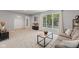 Bright living room with a large window, neutral carpet, and cozy seating arrangement at 1930 Bechtel Rd, Indianapolis, IN 46260