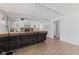 Bright living room features white walls, wood beam ceilings, stone fireplace, and wood flooring at 1930 Bechtel Rd, Indianapolis, IN 46260