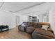 Spacious living room with white walls, wood beam ceilings, wood floors, and comfortable seating at 1930 Bechtel Rd, Indianapolis, IN 46260