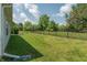 Spacious, lush backyard featuring manicured lawn and black metal fence at 19555 Kailey Way, Noblesville, IN 46062