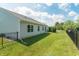 Backyard featuring lush lawn, black fence and mature trees at 19555 Kailey Way, Noblesville, IN 46062