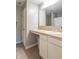 Bathroom vanity with light beige countertop and white cabinet doors on tiled flooring at 19555 Kailey Way, Noblesville, IN 46062