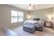 Comfortable bedroom featuring a large window, ceiling fan, and neutral color scheme at 19555 Kailey Way, Noblesville, IN 46062