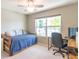 Bedroom with twin bed, wooden frame and desk setup next to window, featuring great natural light at 19555 Kailey Way, Noblesville, IN 46062