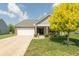 Charming single Gathering home featuring a well-manicured lawn and inviting front porch at 19555 Kailey Way, Noblesville, IN 46062