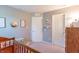 Hallway with multiple doors, neutral walls and carpet flooring, featuring a wooden banister at 19555 Kailey Way, Noblesville, IN 46062