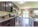 Modern kitchen with stainless steel appliances, granite countertops, and ample cabinet space at 19555 Kailey Way, Noblesville, IN 46062
