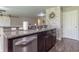 Stylish kitchen featuring granite countertops, stainless steel appliances and breakfast bar at 19555 Kailey Way, Noblesville, IN 46062
