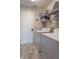 Well-organized laundry room with modern appliances and storage shelves at 19555 Kailey Way, Noblesville, IN 46062