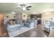 Open-concept kitchen and living space, with a large sectional couch and plenty of natural light at 19555 Kailey Way, Noblesville, IN 46062