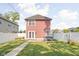Fenced backyard with a manicured lawn, patio, and hot tub; perfect for entertaining at 2015 N College Ave, Indianapolis, IN 46202