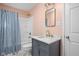 Charming bathroom featuring a marble countertop vanity and patterned shower curtain at 2015 N College Ave, Indianapolis, IN 46202