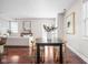 Open-concept dining area with hardwood floors and view of the living room at 2015 N College Ave, Indianapolis, IN 46202