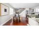 Spacious dining area with hardwood floors and access to the kitchen and living room at 2015 N College Ave, Indianapolis, IN 46202