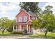 Charming two-story home with a classic porch and a well-maintained lawn at 2015 N College Ave, Indianapolis, IN 46202
