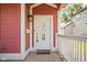 Charming front door with decorative glass, and porch with white railings at 2015 N College Ave, Indianapolis, IN 46202