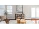 Detailed view of a staged living room with modern décor, hardwood floors and natural light at 2015 N College Ave, Indianapolis, IN 46202