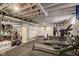 Finished basement featuring gym equipment, painted walls, and an open ceiling at 2332 Central Ave, Indianapolis, IN 46205