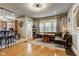 Dining room features an integrated banquet seating, hardwood floors, and modern lighting at 2332 Central Ave, Indianapolis, IN 46205