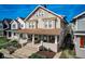 Charming two-story home with a covered front porch, beautiful landscaping, and classic architectural details at 2332 Central Ave, Indianapolis, IN 46205