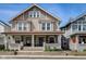 Inviting two-story duplex showcasing a charming front porch, offering a warm and welcoming curb appeal at 2332 Central Ave, Indianapolis, IN 46205