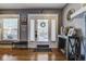 Inviting foyer featuring a rustic console table, stylish decor, and hardwood floors at 2332 Central Ave, Indianapolis, IN 46205